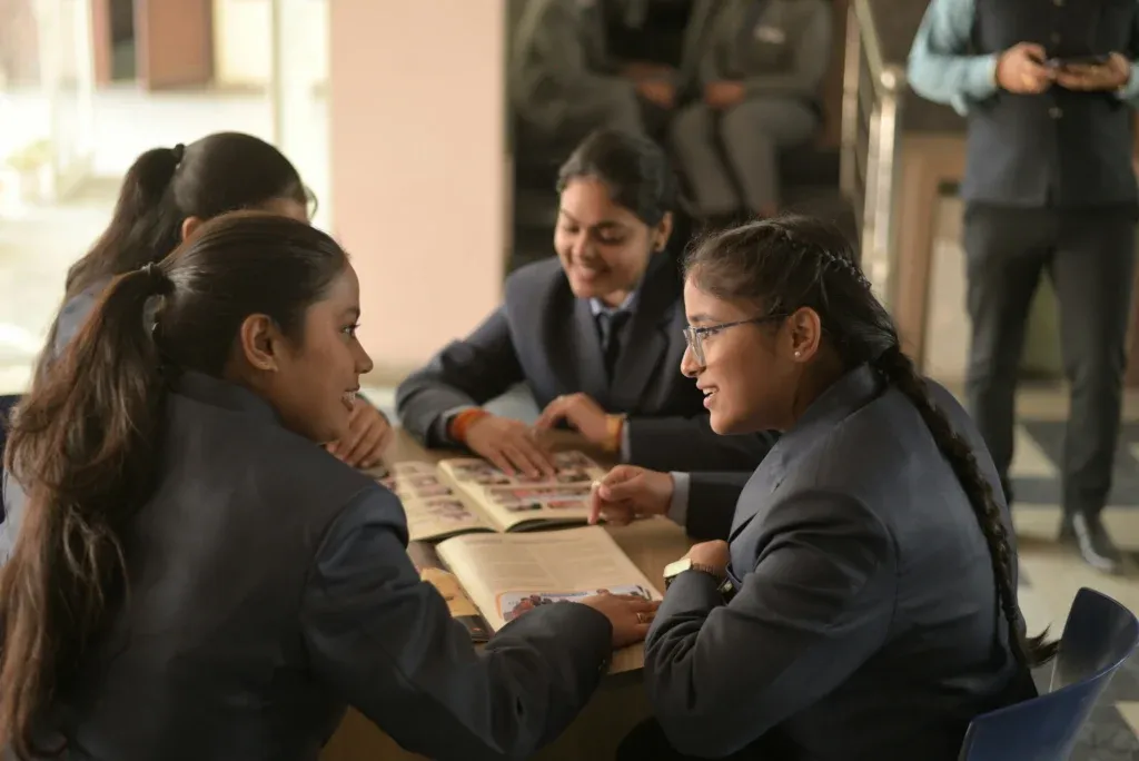 Group of teenagers working together on a school project